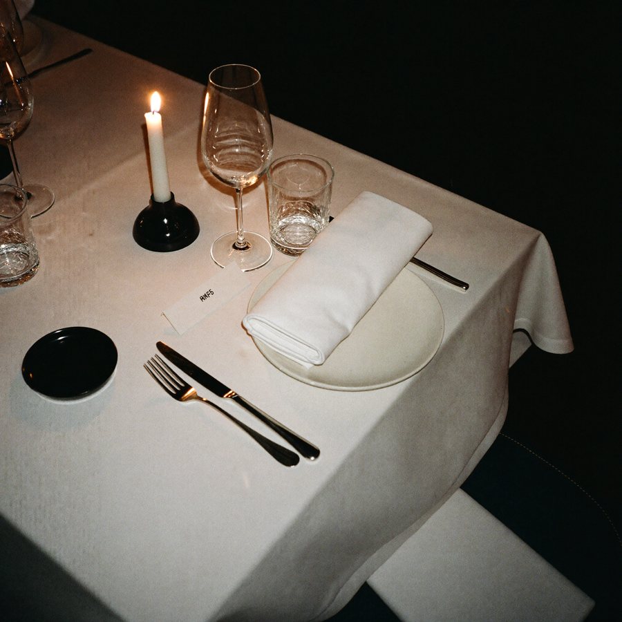 A laid table in low warm light.