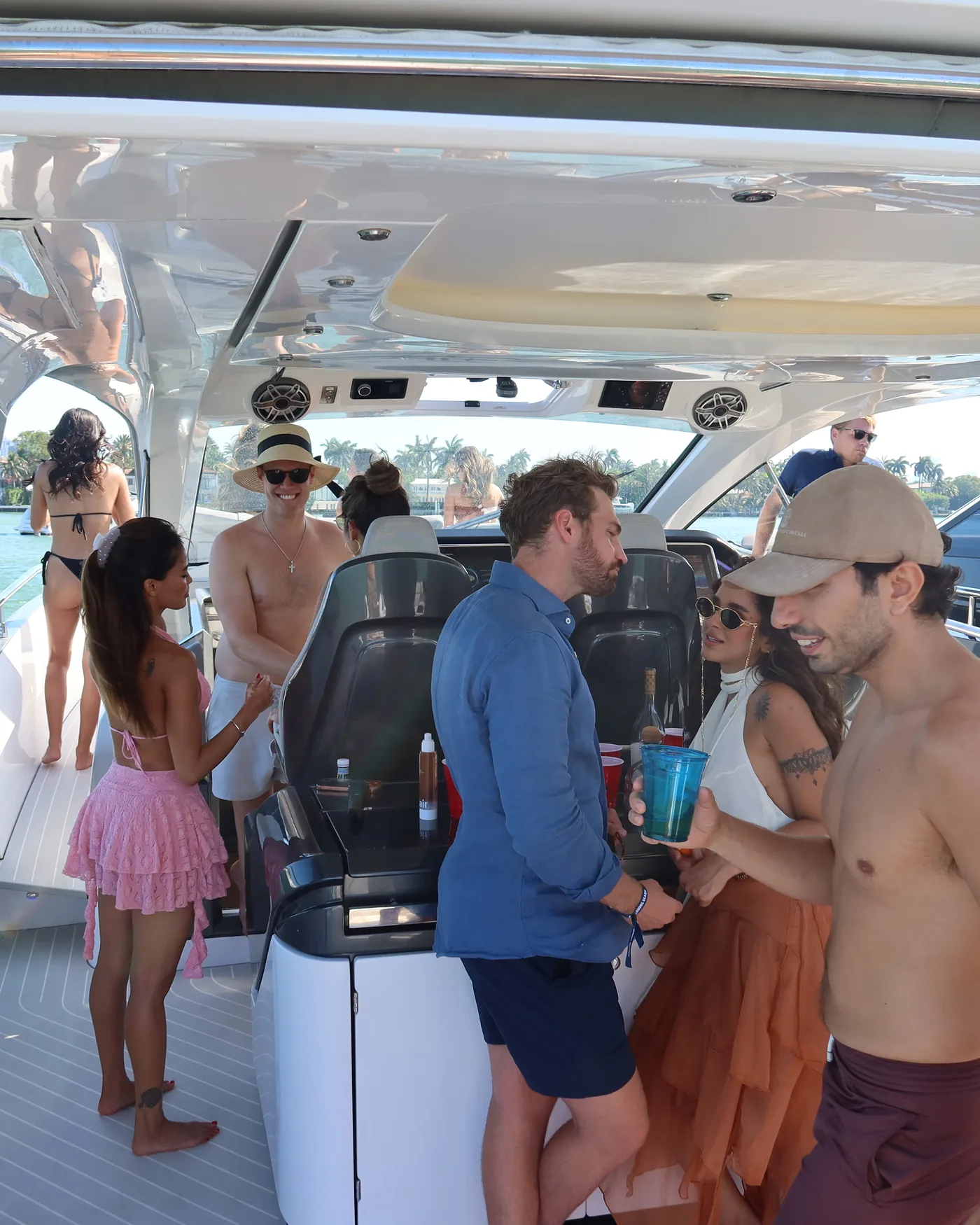 A group on the aft deck of a day boat, Biscayne Bay behind them.
