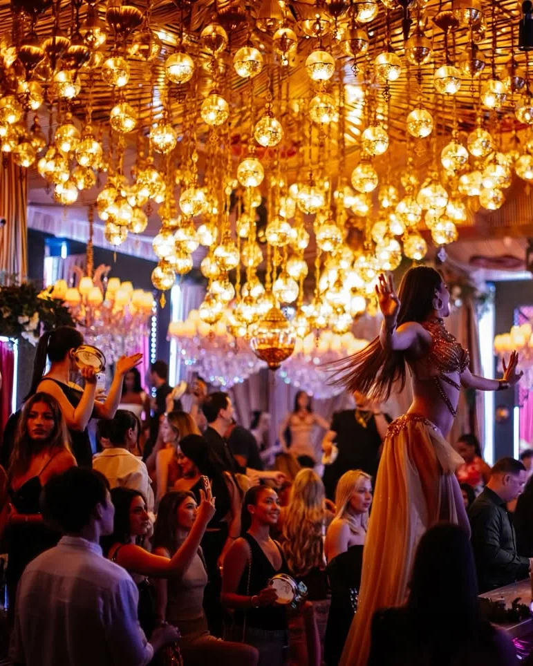 The room at Habibi under its chandeliers.