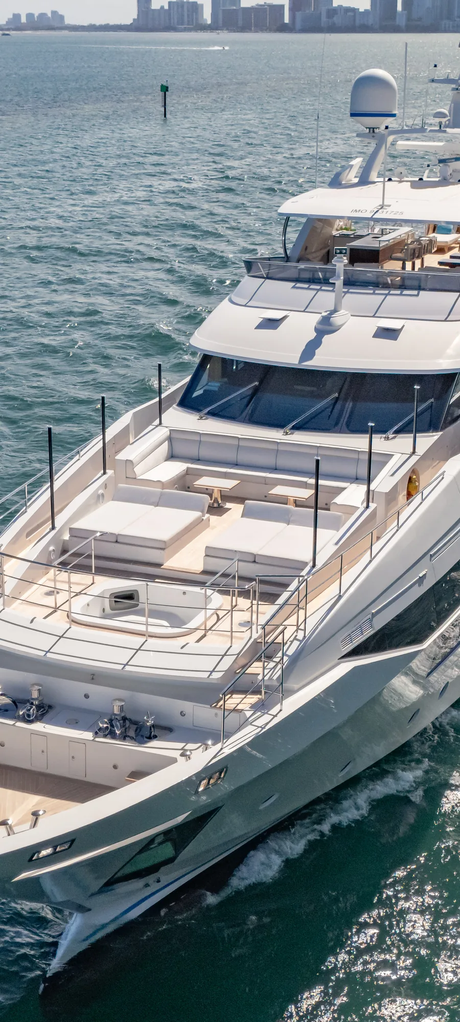 A yacht under way on Biscayne Bay, seen from above.