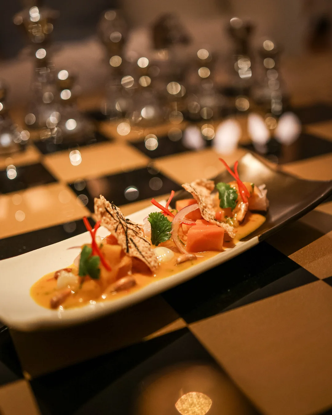 Plates and candles on a dinner table at Bonito, Gustavia.
