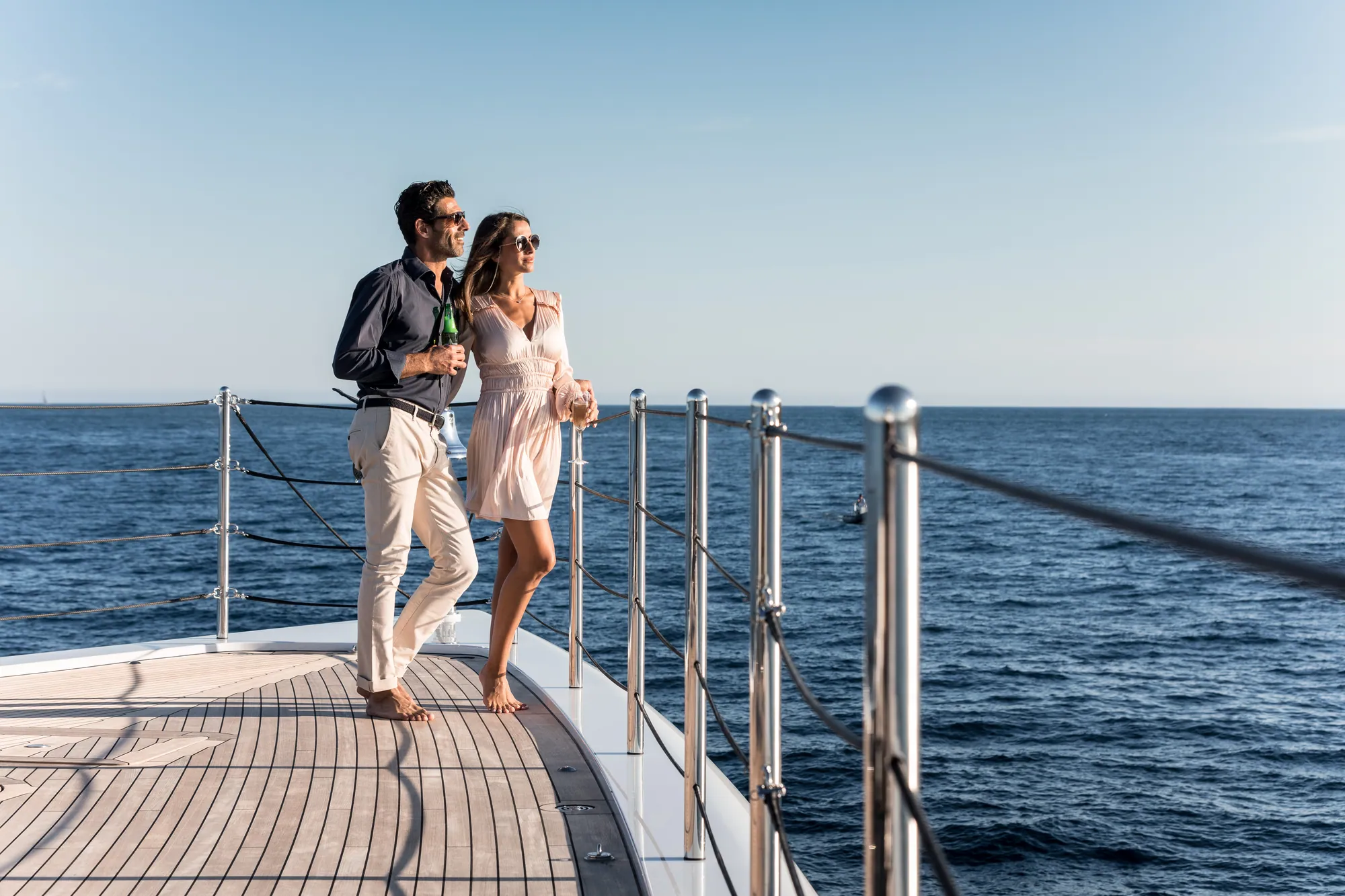 Two guests walking the foredeck of TRIUMPH.